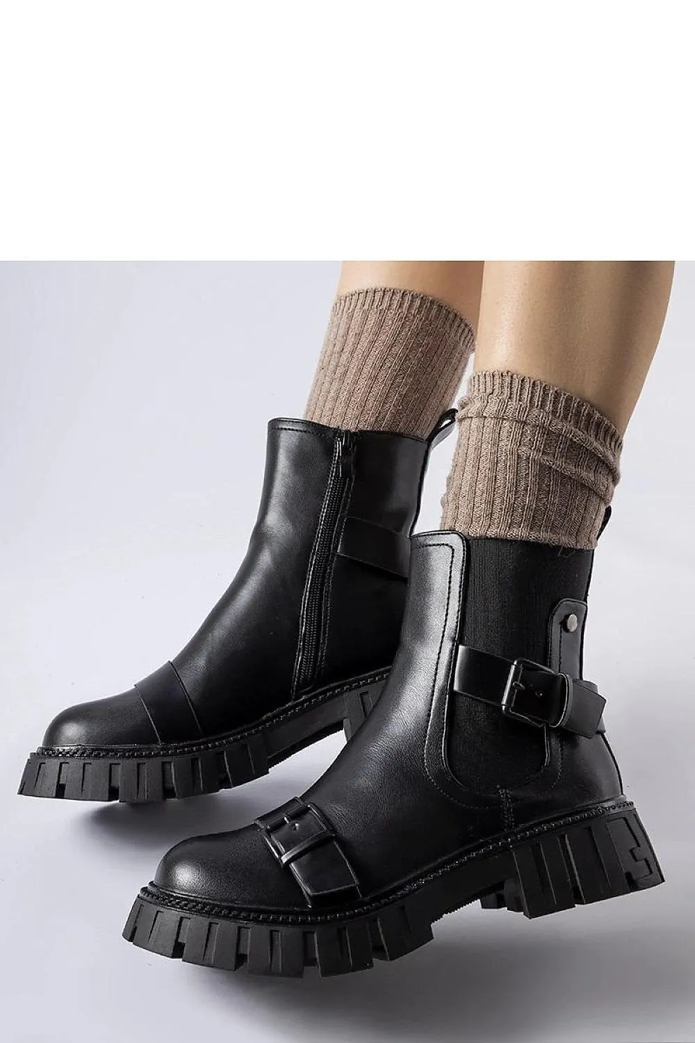 Black ankle heel boots with a massive sole